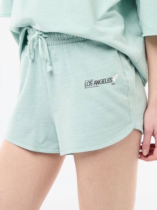 Pantalón corto en felpa con inscripción - Kiabi