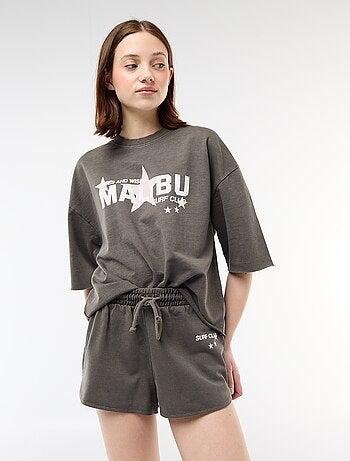 Pantalón corto en felpa con inscripción