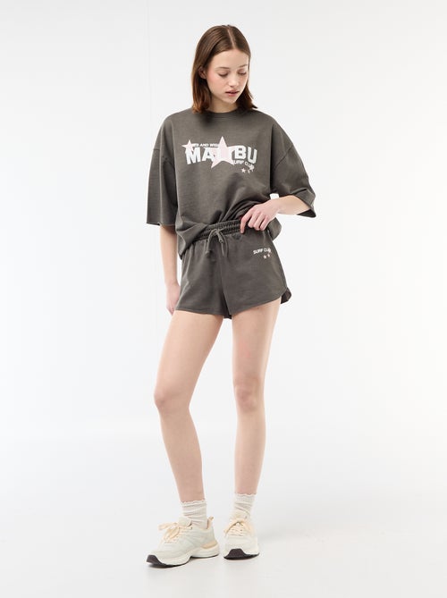 Pantalón corto en felpa con inscripción - Kiabi