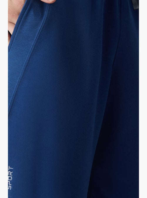 Pantalón corto jogging mezcla de algodón tommy - Kiabi Pantalón corto jogging mezcla de algodón tommy - Kiabi