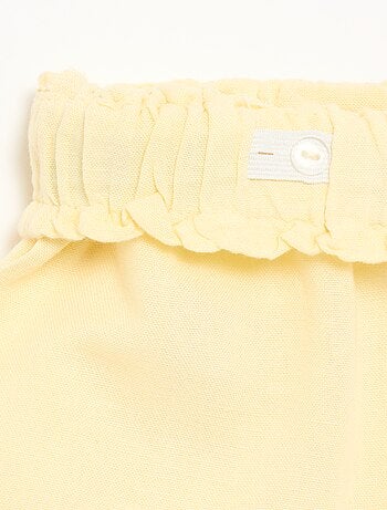 Pantalón corto liso con lazo de fantasía