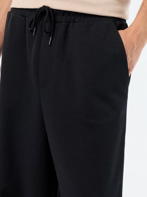 Pantalón de chándal ancho de felpa ligera - Kiabi Pantalón de chándal ancho de felpa ligera - Kiabi
