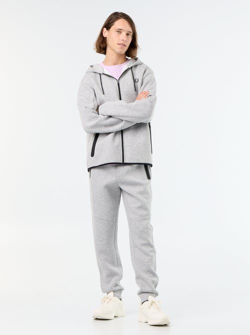 Pantalón de chándal con bolsillos con cremallera - Kiabi Pantalón de chándal con bolsillos con cremallera - Kiabi
