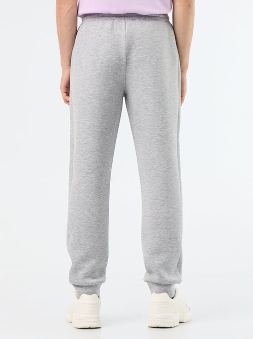 Pantalón de chándal con bolsillos con cremallera - Kiabi Pantalón de chándal con bolsillos con cremallera - Kiabi