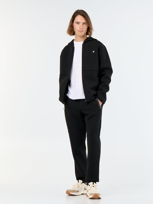 Pantalón de chándal con bolsillos con cremallera - Kiabi Pantalón de chándal con bolsillos con cremallera - Kiabi