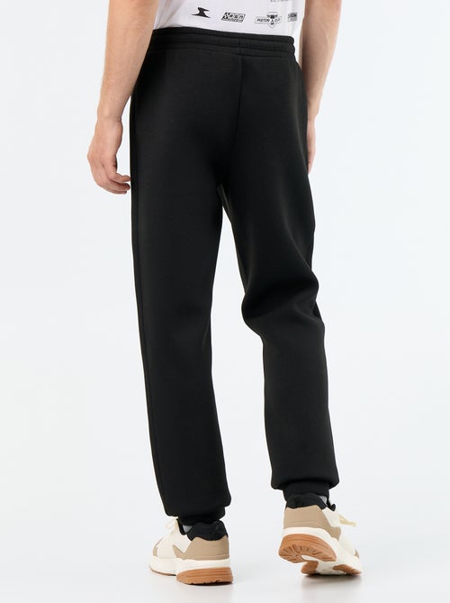 Pantalón de chándal con bolsillos con cremallera - Kiabi Pantalón de chándal con bolsillos con cremallera - Kiabi
