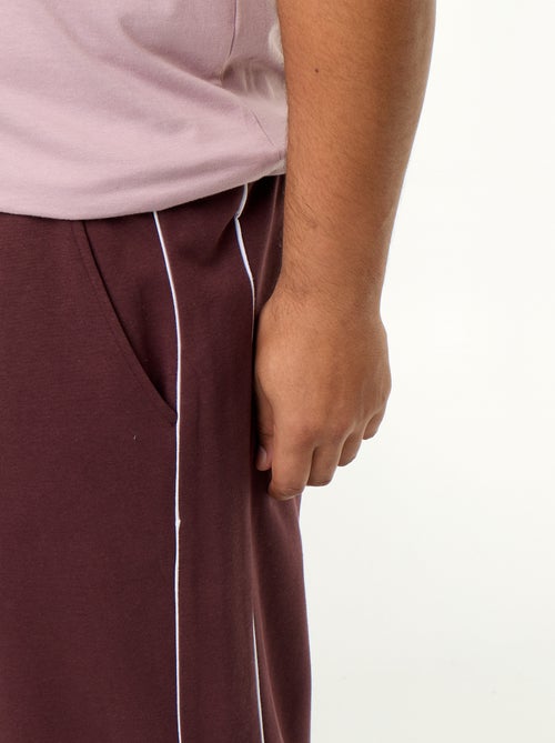 Pantalón de chándal con ribetes contrastados - Kiabi Pantalón de chándal con ribetes contrastados - Kiabi