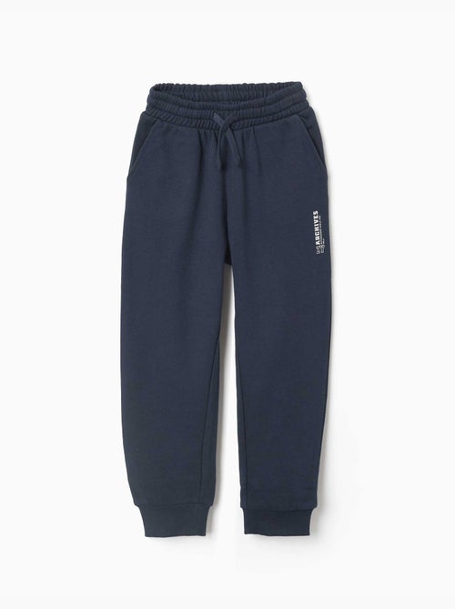 Pantalón de chándal de felpa con bolsillos y estampado ZY - Kiabi Pantalón de chándal de felpa con bolsillos y estampado ZY - Kiabi
