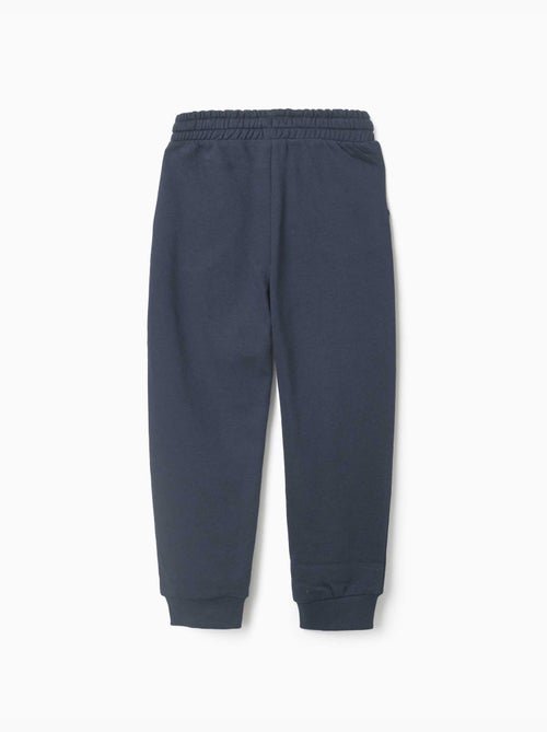 Pantalón de chándal de felpa con bolsillos y estampado ZY - Kiabi Pantalón de chándal de felpa con bolsillos y estampado ZY - Kiabi