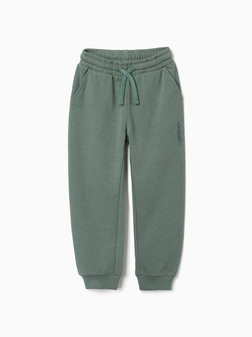 Pantalón de chándal de felpa con bolsillos y estampado ZY - Kiabi Pantalón de chándal de felpa con bolsillos y estampado ZY - Kiabi