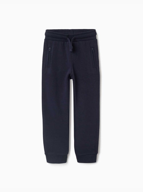 Pantalón de chándal de felpa con cordón y bolsillos - Kiabi Pantalón de chándal de felpa con cordón y bolsillos - Kiabi