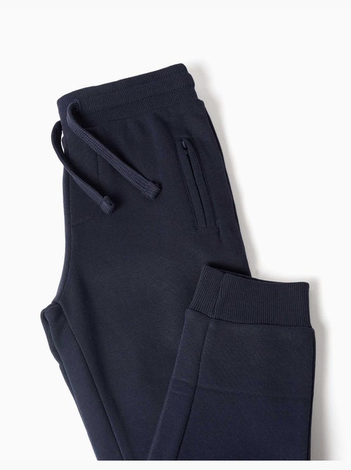 Pantalón de chándal de felpa con cordón y bolsillos - Kiabi Pantalón de chándal de felpa con cordón y bolsillos - Kiabi