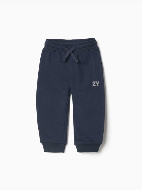 Pantalón de chándal de felpa con cordón y estampado - Kiabi Pantalón de chándal de felpa con cordón y estampado - Kiabi