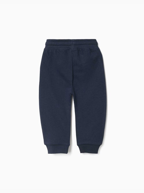 Pantalón de chándal de felpa con cordón y estampado - Kiabi Pantalón de chándal de felpa con cordón y estampado - Kiabi