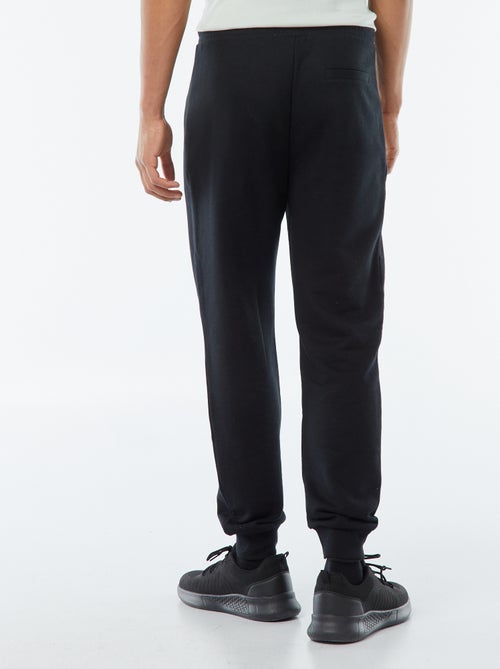 Pantalón de chándal de felpa ligera con bolsillos con cremallera - Kiabi