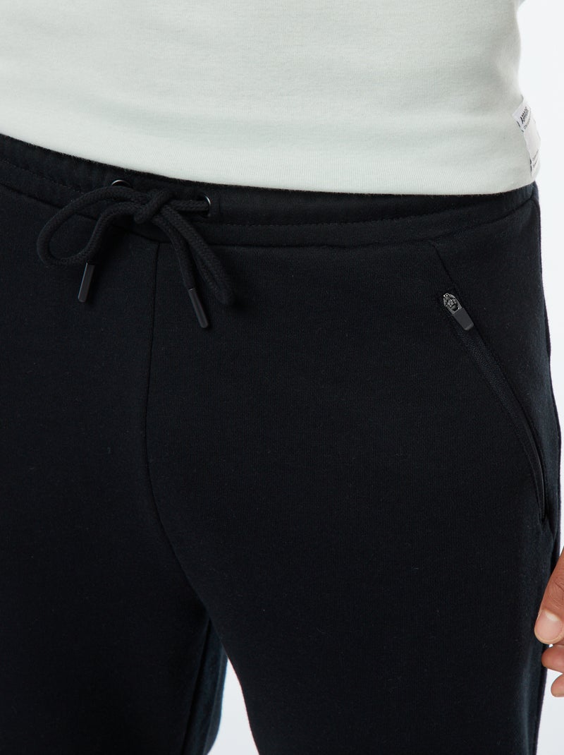 Pantalón de chándal de felpa ligera con bolsillos con cremallera negro - Kiabi
