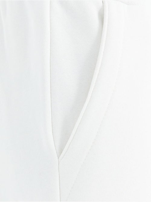 Pantalón de chándal de forro polar relaxed fit para hombre tommy - Kiabi Pantalón de chándal de forro polar relaxed fit para hombre tommy - Kiabi