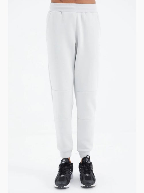 Pantalón de chándal de forro polar relaxed fit para hombre tommy - Kiabi Pantalón de chándal de forro polar relaxed fit para hombre tommy - Kiabi