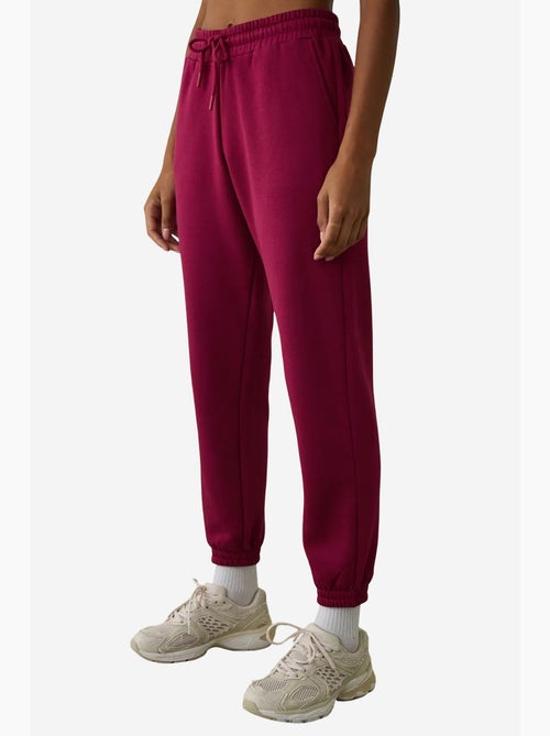 Pantalón de chándal de tiro alto con detalle de lazo, afelpado penti - Kiabi Pantalón de chándal de tiro alto con detalle de lazo, afelpado penti - Kiabi