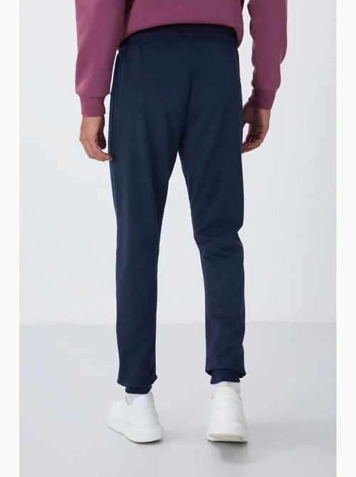 Pantalón de chándal jogger de hombre con bolsillo con cremallera tommy - Kiabi Pantalón de chándal jogger de hombre con bolsillo con cremallera tommy - Kiabi
