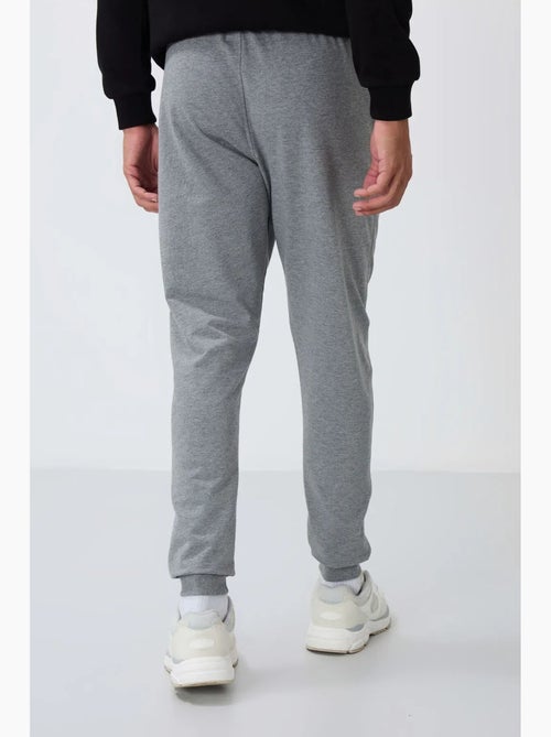Pantalón de chándal jogger de hombre con bolsillo con cremallera tommy - Kiabi Pantalón de chándal jogger de hombre con bolsillo con cremallera tommy - Kiabi