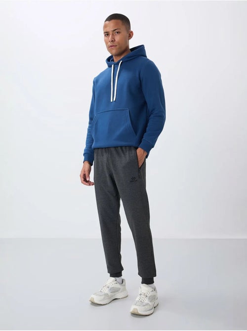 Pantalón de chándal jogger de hombre con bolsillo con cremallera tommy - Kiabi Pantalón de chándal jogger de hombre con bolsillo con cremallera tommy - Kiabi