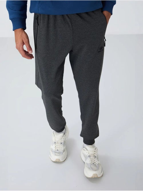 Pantalón de chándal jogger de hombre con bolsillo con cremallera tommy - Kiabi Pantalón de chándal jogger de hombre con bolsillo con cremallera tommy - Kiabi