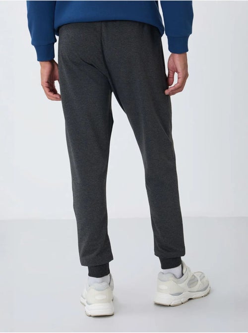 Pantalón de chándal jogger de hombre con bolsillo con cremallera tommy - Kiabi Pantalón de chándal jogger de hombre con bolsillo con cremallera tommy - Kiabi