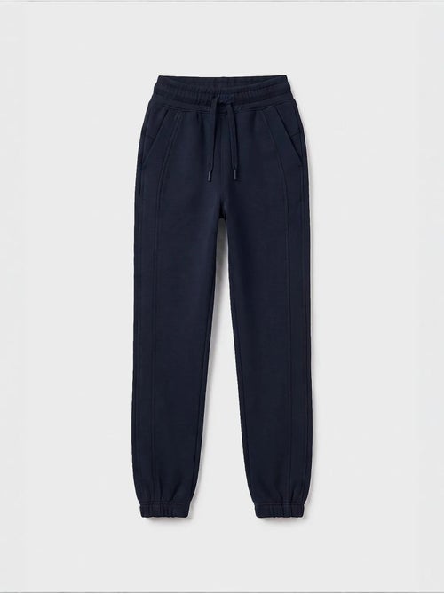 Pantalón de chándal juvenil unisex de algodón y poliéster tommy - Kiabi Pantalón de chándal juvenil unisex de algodón y poliéster tommy - Kiabi
