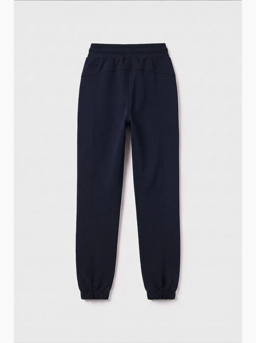 Pantalón de chándal juvenil unisex de algodón y poliéster tommy - Kiabi Pantalón de chándal juvenil unisex de algodón y poliéster tommy - Kiabi