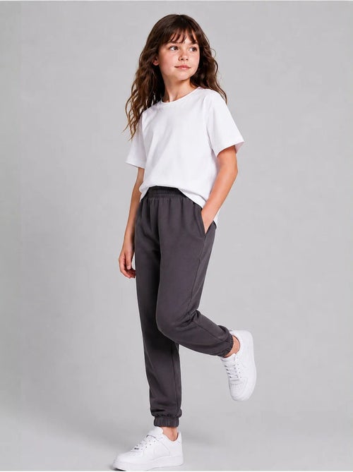 Pantalón de chándal juvenil unisex de algodón y poliéster tommy - Kiabi Pantalón de chándal juvenil unisex de algodón y poliéster tommy - Kiabi