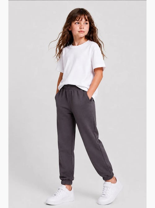 Pantalón de chándal juvenil unisex de algodón y poliéster tommy - Kiabi Pantalón de chándal juvenil unisex de algodón y poliéster tommy - Kiabi