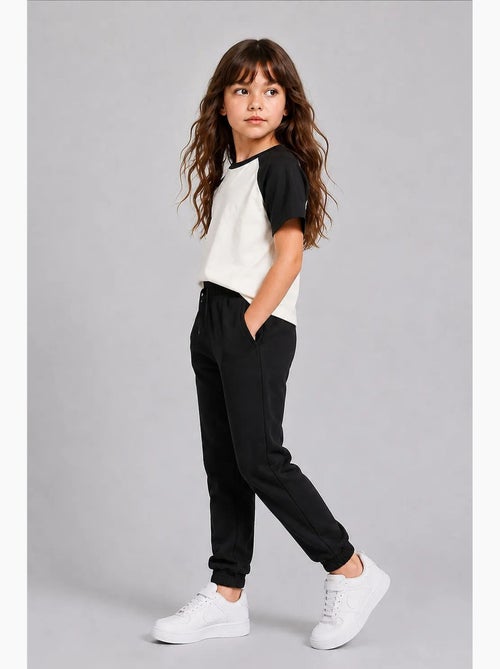 Pantalón de chándal juvenil unisex de algodón y poliéster tommy - Kiabi Pantalón de chándal juvenil unisex de algodón y poliéster tommy - Kiabi