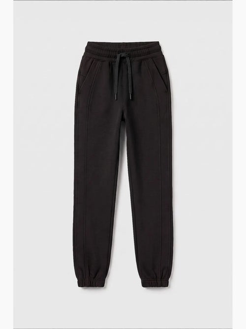 Pantalón de chándal juvenil unisex de algodón y poliéster tommy - Kiabi Pantalón de chándal juvenil unisex de algodón y poliéster tommy - Kiabi