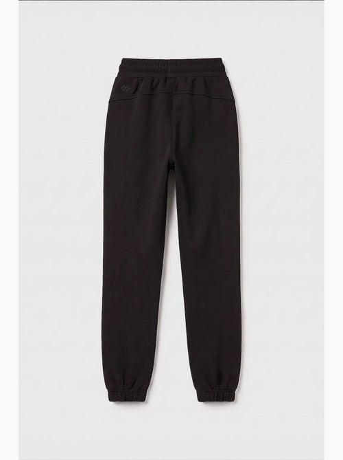 Pantalón de chándal juvenil unisex de algodón y poliéster tommy - Kiabi Pantalón de chándal juvenil unisex de algodón y poliéster tommy - Kiabi