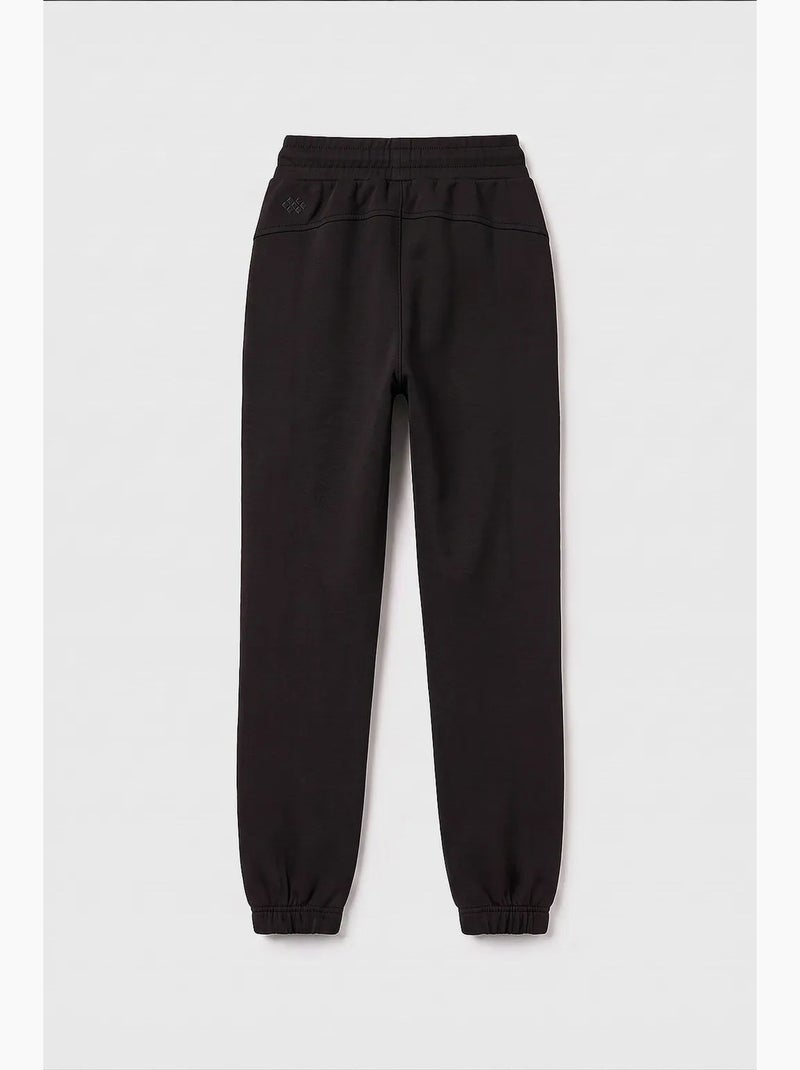 Pantalón de chándal juvenil unisex de algodón y poliéster tommy Negro - Kiabi