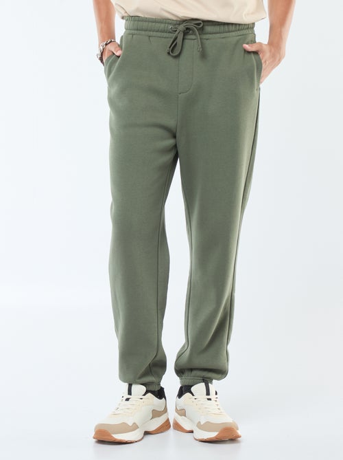 Pantalón de chándal liso con cordones ajustables en la cintura - Kiabi Pantalón de chándal liso con cordones ajustables en la cintura - Kiabi