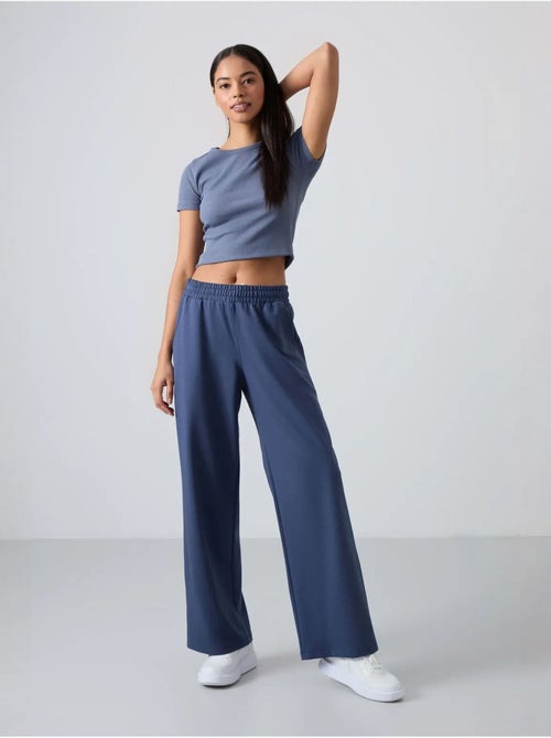 Pantalón de chándal pull-on de pernera ancha tommy - Kiabi Pantalón de chándal pull-on de pernera ancha tommy - Kiabi