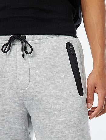 Pantalón de chándal tipo neopreno con bolsillos con cremallera