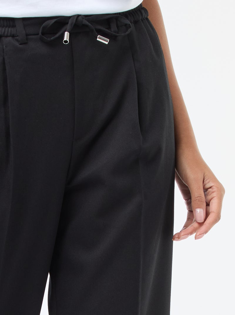 Pantalón de corte ancho con cintura elástica y lazos para anudar Negro - Kiabi