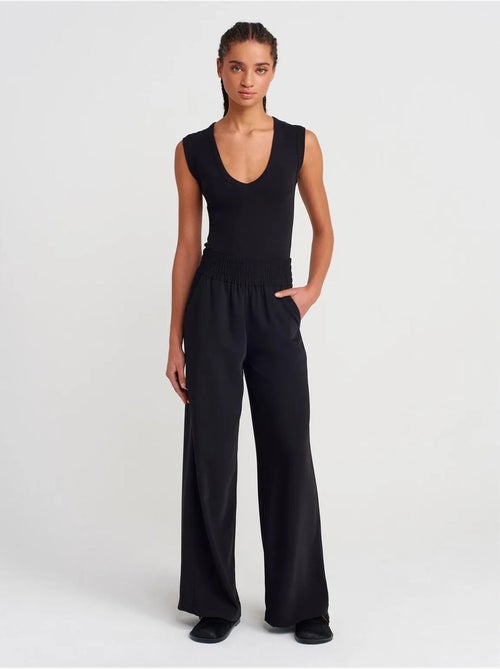 Pantalón de crepé de pernera ancha para mujer - Kiabi Pantalón de crepé de pernera ancha para mujer - Kiabi