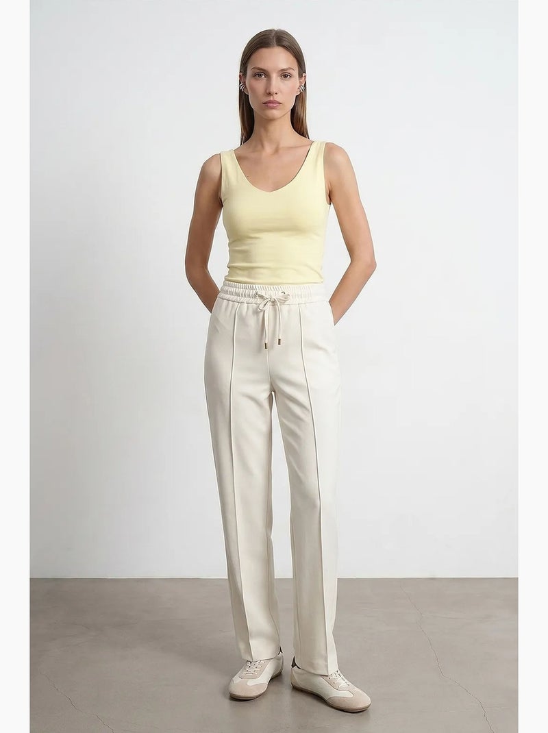 Pantalón de crepé de pernera recta con cintura de cordón ajustable dilvin Blanco roto - Kiabi