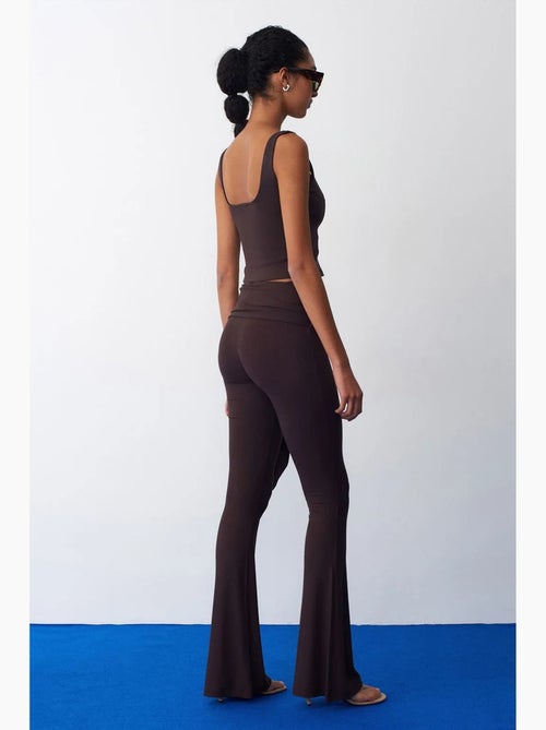Pantalón de jersey acampanado de tiro alto con detalle de lazada dilvin - Kiabi Pantalón de jersey acampanado de tiro alto con detalle de lazada dilvin - Kiabi