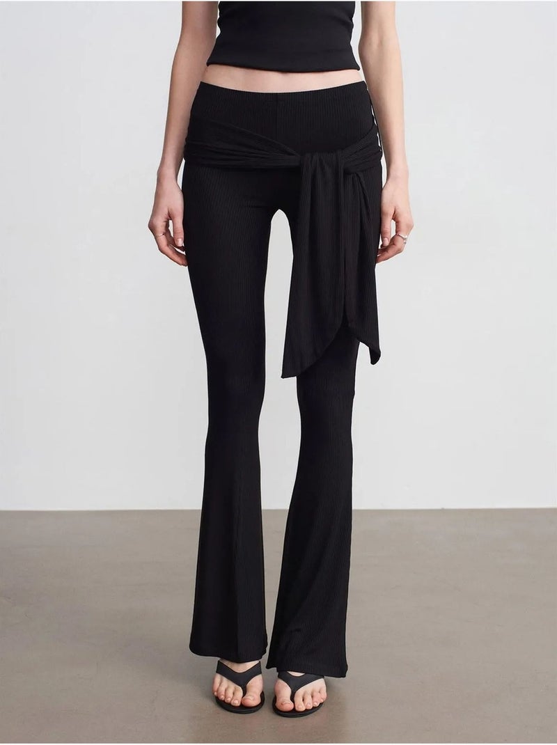 Pantalón de jersey acampanado de tiro alto con detalle de lazada dilvin Negro - Kiabi