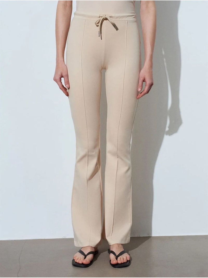 Pantalón de jersey acampanado de tiro medio con cordón dilvin Beige arcilla - Kiabi