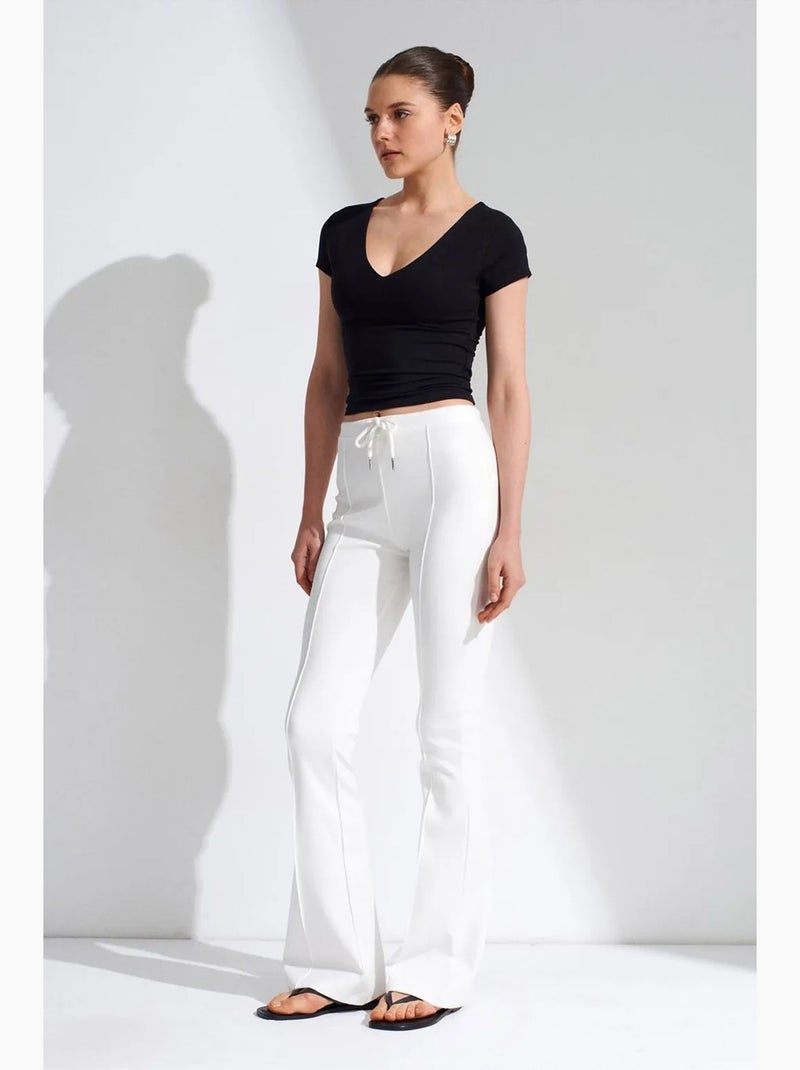 Pantalón de jersey acampanado de tiro medio con cordón dilvin Blanco - Kiabi