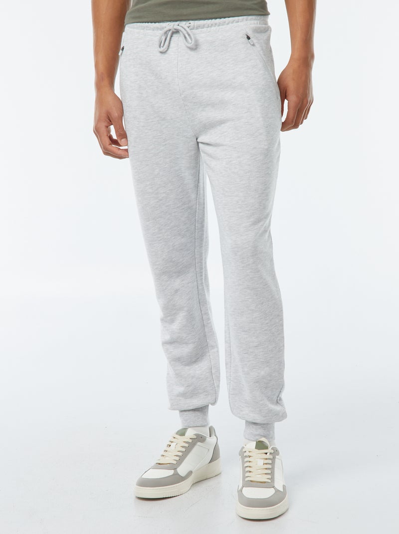 Pantalón de jogging de felpa ligera con bolsillos con cremallera Gris - Kiabi