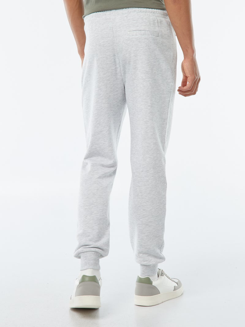 Pantalón de jogging de felpa ligera con bolsillos con cremallera Gris - Kiabi