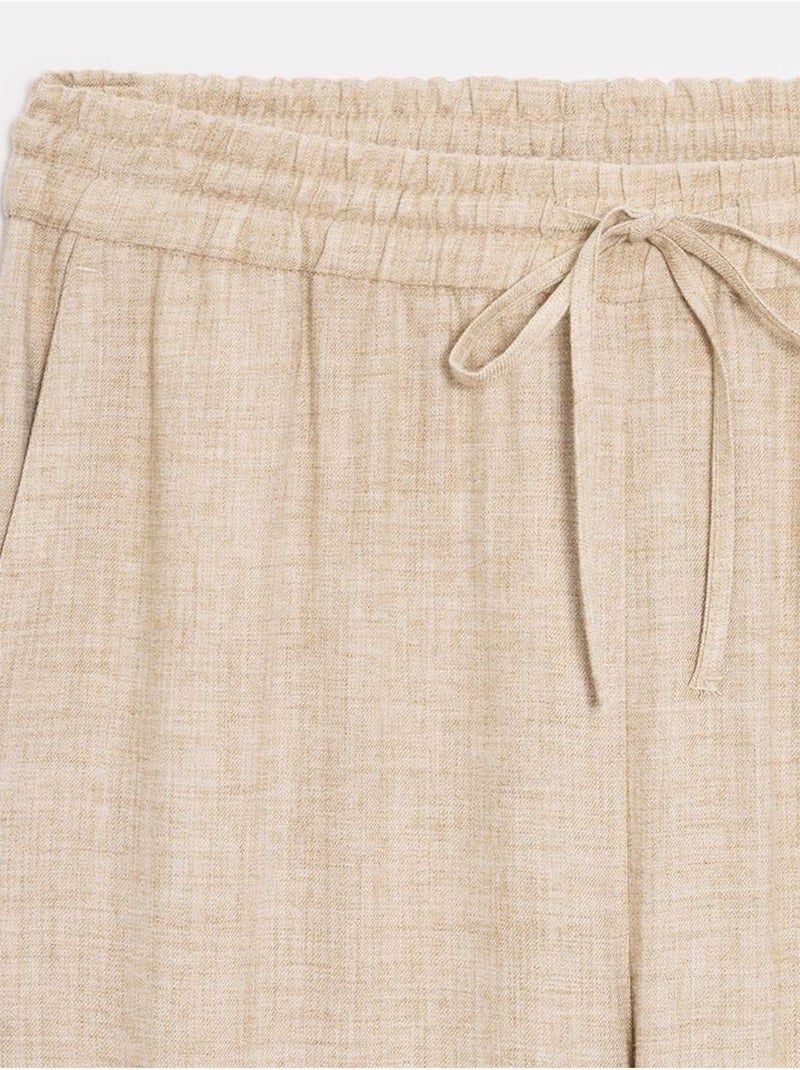 Pantalón de mujer de tejido con pernera ancha y cintura con cordón Beige - Kiabi