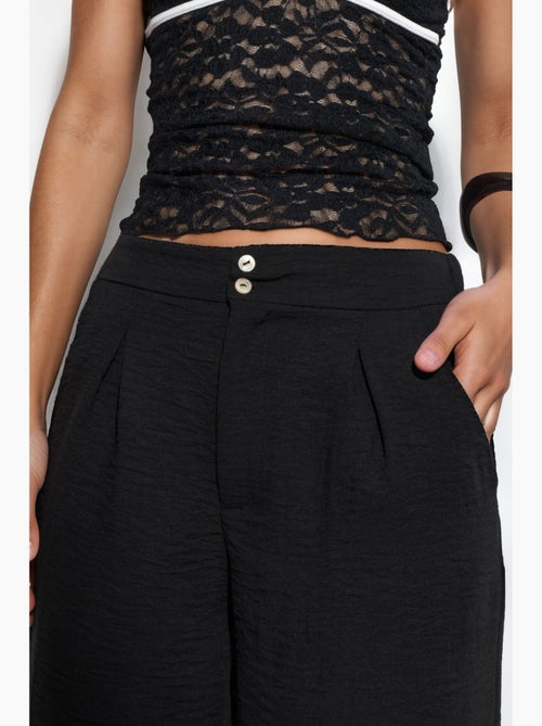 Pantalón de mujer de tiro alto y pernera ancha busem - Kiabi Pantalón de mujer de tiro alto y pernera ancha busem - Kiabi